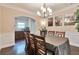 Dining room featuring a chandelier and wood flooring at 4708 Tiger Blvd, Duluth, GA 30096