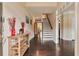 Inviting foyer with dark hardwood floors, a staircase, and stylish accents at 4708 Tiger Blvd, Duluth, GA 30096
