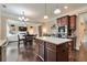 Open-concept kitchen with stainless steel appliances and granite countertops at 4708 Tiger Blvd, Duluth, GA 30096