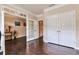An elegant living room featuring hardwood floors and an open doorway to the rest of the house at 4708 Tiger Blvd, Duluth, GA 30096