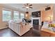 Bright living room with fireplace, tv, ceiling fan and lots of natural light at 4708 Tiger Blvd, Duluth, GA 30096