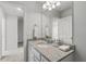 Bathroom features a granite vanity, a large mirror, and ample storage, creating a functional design at 6003 Pine Bluff Pl, Conyers, GA 30013