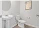 Powder room with a pedestal sink, a modern toilet, and a clean design, maximizing the space at 6003 Pine Bluff Pl, Conyers, GA 30013