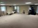 Large finished basement featuring ample carpeted space, neutral colors and natural light at 1159 Aurora Ct, Atlanta, GA 30338