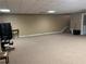 Large finished basement featuring ample carpeted space and neutral colors at 1159 Aurora Ct, Atlanta, GA 30338