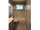 Bathroom with a gray tile shower, matching vanity, and toilet at 1159 Aurora Ct, Atlanta, GA 30338
