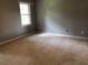 Bedroom with gray walls and neutral colored carpet at 1159 Aurora Ct, Atlanta, GA 30338
