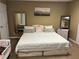 Bedroom with a queen bed and art and décor next to a pair of toddler beds at 1159 Aurora Ct, Atlanta, GA 30338