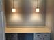 A desk with lights overhead and cabinets below the desk at 1159 Aurora Ct, Atlanta, GA 30338