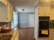 Spacious kitchen with hardwood floors, granite countertops, and stainless steel appliances at 1159 Aurora Ct, Atlanta, GA 30338