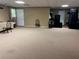 Spacious living room with neutral carpet and three chairs at 1159 Aurora Ct, Atlanta, GA 30338