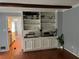 Living room boasts a built in hutch with wood floors and natural light at 1159 Aurora Ct, Atlanta, GA 30338