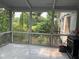 Sunroom featuring tiled flooring and views of the backyard at 1159 Aurora Ct, Atlanta, GA 30338