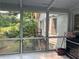 Backyard view from a cozy sunroom with tiled flooring and exterior cooking setup at 1159 Aurora Ct, Atlanta, GA 30338