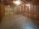 Unfinished basement area showcasing the stud framing and potential for customization at 132 Lynnview Ct, Mcdonough, GA 30252