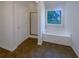 Bathroom featuring large tub with jets and shower behind glass door at 132 Lynnview Ct, Mcdonough, GA 30252