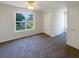 Bedroom with a ceiling fan and window to backyard at 132 Lynnview Ct, Mcdonough, GA 30252