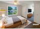 Cozy bedroom with a ceiling fan and bright window to the backyard at 132 Lynnview Ct, Mcdonough, GA 30252