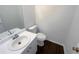 Small powder room with a clean sink and toilet at 132 Lynnview Ct, Mcdonough, GA 30252