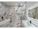 Beautiful bathroom features a marble shower and walls, modern fixtures, and a free-standing tub at 2751 Camp Branch Rd, Buford, GA 30519