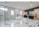 Stunning bathroom with marble floors and walls, soaking tub, and dual vanities at 2751 Camp Branch Rd, Buford, GA 30519