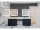 Well-lit bathroom featuring dual sinks, dark cabinets, white marble countertops and walls at 2751 Camp Branch Rd, Buford, GA 30519