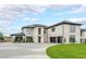 Stunning white brick home featuring a spacious driveway and lush green lawn at 2751 Camp Branch Rd, Buford, GA 30519