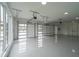 Spacious three car garage with white doors, epoxy floors, and plenty of space for storage at 2751 Camp Branch Rd, Buford, GA 30519