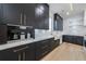 Elegant kitchen with dark cabinets, marble countertops, and built-in appliances at 2751 Camp Branch Rd, Buford, GA 30519
