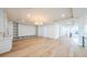 Bright living room with hardwood floors, recessed lighting, built-in shelves, and coffered ceiling at 2751 Camp Branch Rd, Buford, GA 30519