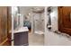 Bathroom featuring decorative mirrors and a glass enclosed shower viewed from the bedroom at 2884 Overwood Ln, Snellville, GA 30078