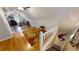 Large bonus room with hardwood floors, kitchen area, and stairs to another level at 2884 Overwood Ln, Snellville, GA 30078