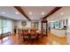 Bright dining room features wood floors, exposed beams, and ample seating at 2884 Overwood Ln, Snellville, GA 30078