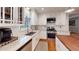 Well-equipped kitchen with white cabinets, stainless steel appliances, and granite countertops at 2884 Overwood Ln, Snellville, GA 30078