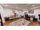 Functional home office with hardwood floors, a large desk, and a comfortable work space at 2884 Overwood Ln, Snellville, GA 30078