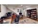 Spacious home office featuring hardwood floors, built-in bookshelves, and comfortable seating at 2884 Overwood Ln, Snellville, GA 30078