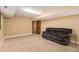 Basement with carpeted floor and comfortable seating at 1935 Northbrooke Ln, Dunwoody, GA 30338
