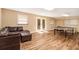 Finished basement featuring sleek floors, comfortable leather seating, and a ping pong table at 1935 Northbrooke Ln, Dunwoody, GA 30338