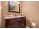 Bathroom vanity featuring granite countertops, dark wood cabinets, and modern fixtures at 1935 Northbrooke Ln, Dunwoody, GA 30338