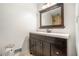 Modern bathroom vanity with dark wood cabinets and a large mirror at 1935 Northbrooke Ln, Dunwoody, GA 30338