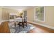 Cozy dining room features hardwood floors and sunlit windows, perfect for intimate gatherings at 1935 Northbrooke Ln, Dunwoody, GA 30338