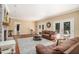 Open concept living room with hardwood floors, fireplace, and French doors to the outdoor space at 1935 Northbrooke Ln, Dunwoody, GA 30338