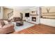 Inviting living room features a cozy fireplace with brick surround and stylish built-in cabinets at 1935 Northbrooke Ln, Dunwoody, GA 30338