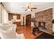 Spacious living room boasting hardwood floors, fireplace, natural light, wet bar, and comfortable seating area at 1935 Northbrooke Ln, Dunwoody, GA 30338