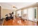 Spacious living room boasting hardwood floors, fireplace, natural light, and a comfortable seating area at 1935 Northbrooke Ln, Dunwoody, GA 30338