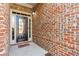 Welcoming front entryway with brick accents and a black door with sidelights at 1955 Overlook Run Pl, Cumming, GA 30040