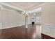 Spacious living room with hardwood floors, fireplace, and an open layout at 1955 Overlook Run Pl, Cumming, GA 30040