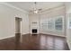 Cozy living area with a fireplace, hardwood floors, and ample natural light at 1955 Overlook Run Pl, Cumming, GA 30040