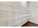Pantry with multiple shelves for storage and organization at 1955 Overlook Run Pl, Cumming, GA 30040
