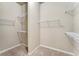 Spacious walk-in closet with built-in shelving for optimal storage and organization at 1955 Overlook Run Pl, Cumming, GA 30040